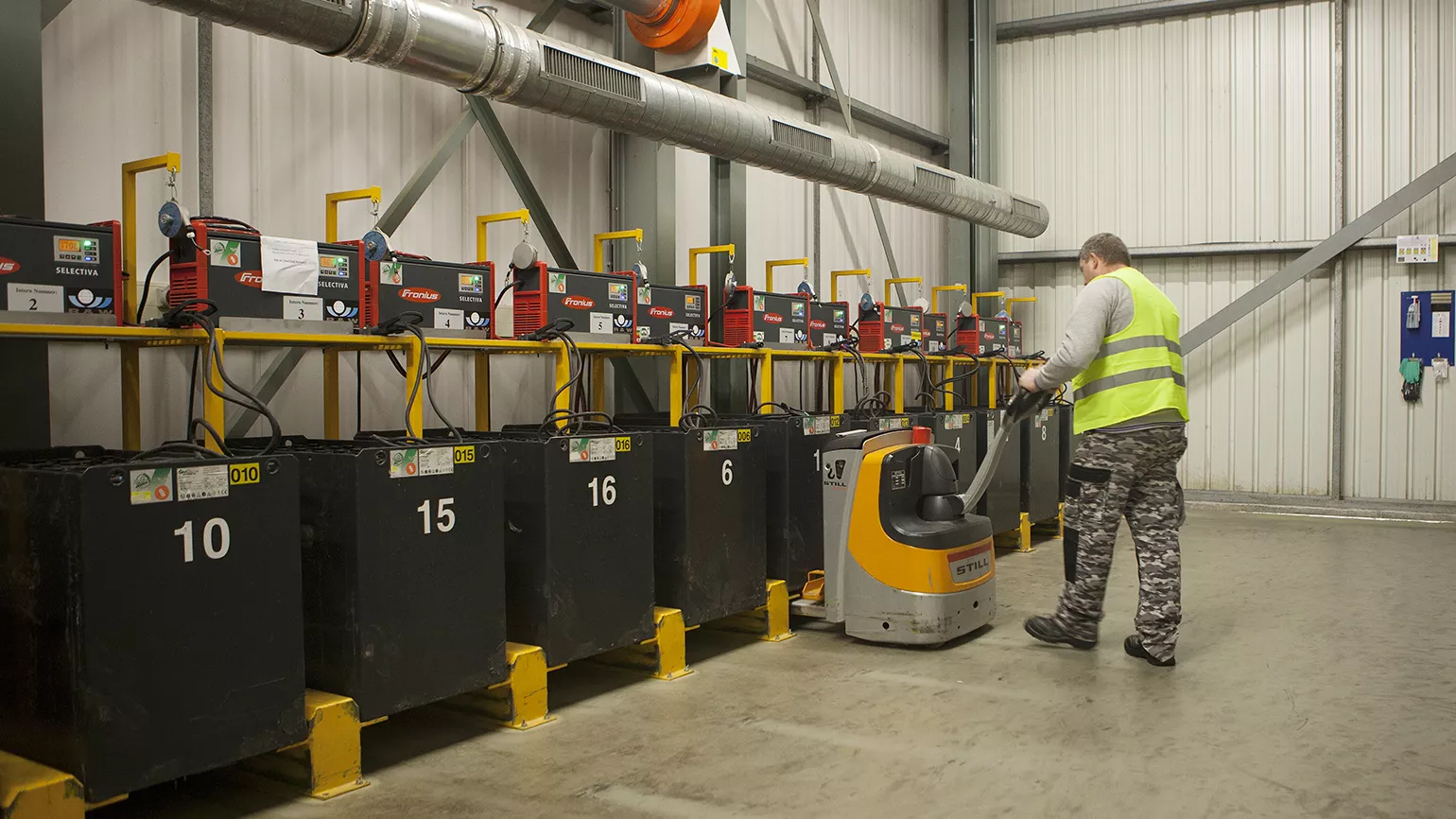remove the heavy 80-volt batteries from the vehicle using a manual lift truck