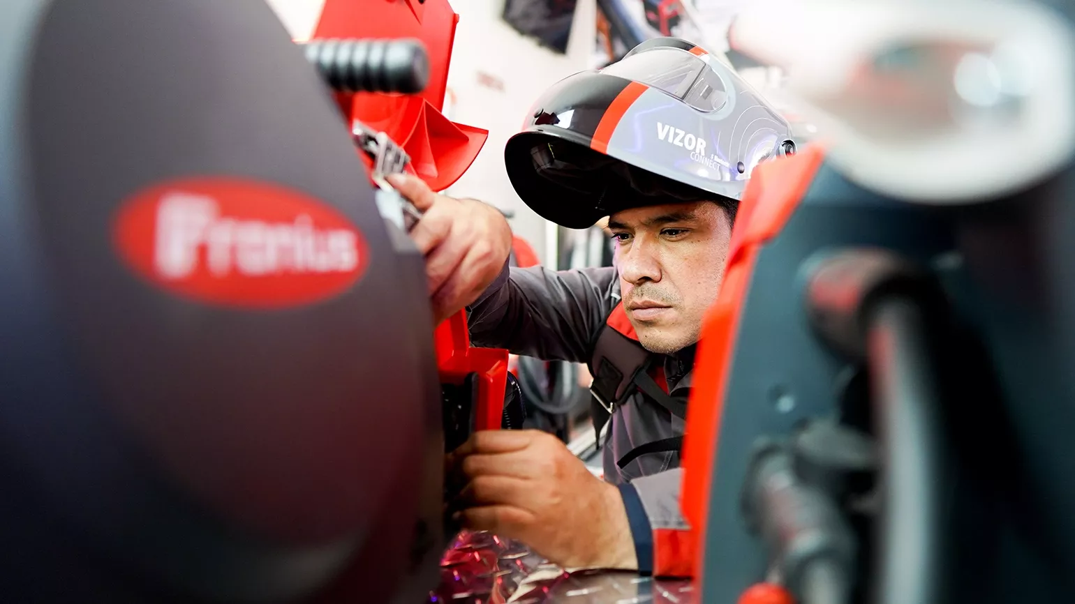 Fronius employee working with a Fronius welding machine