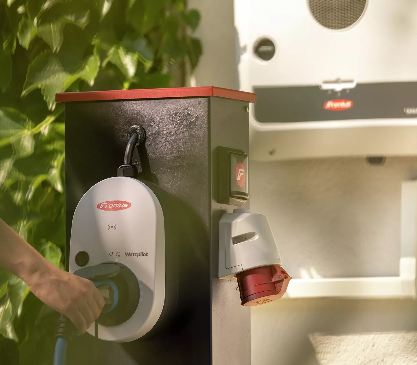 Fronius Wattpilot in the foreground, with the Fronius GEN24 visible in the background.