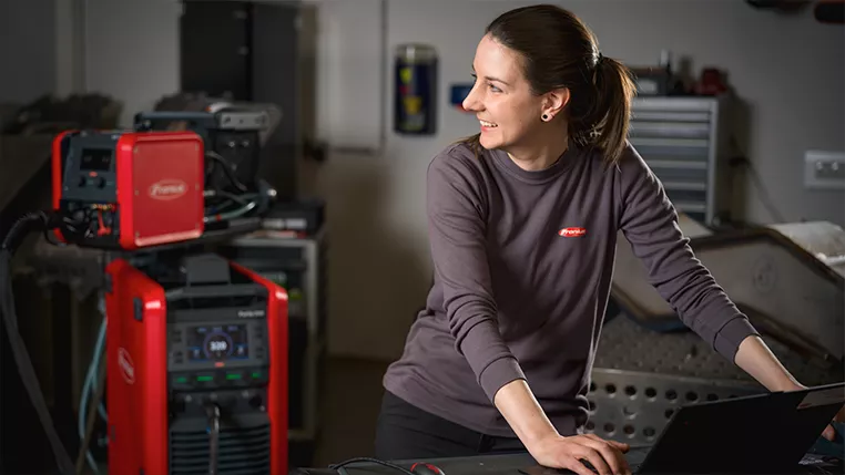Technician works on laptop