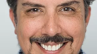 Fronius employee smiling in the camera