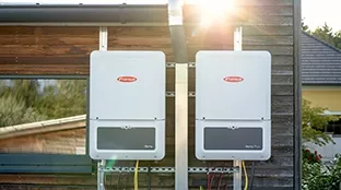 Fronius Verto and Verto Plus inverter mounted on wooden wall