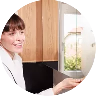Woman in bathroom in front of mirror