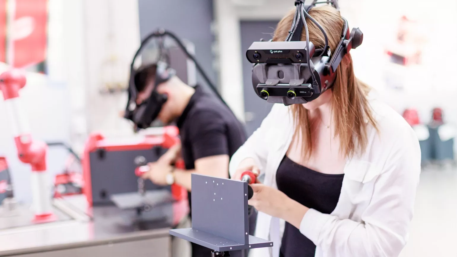 Girl learns to weld on a simulator
