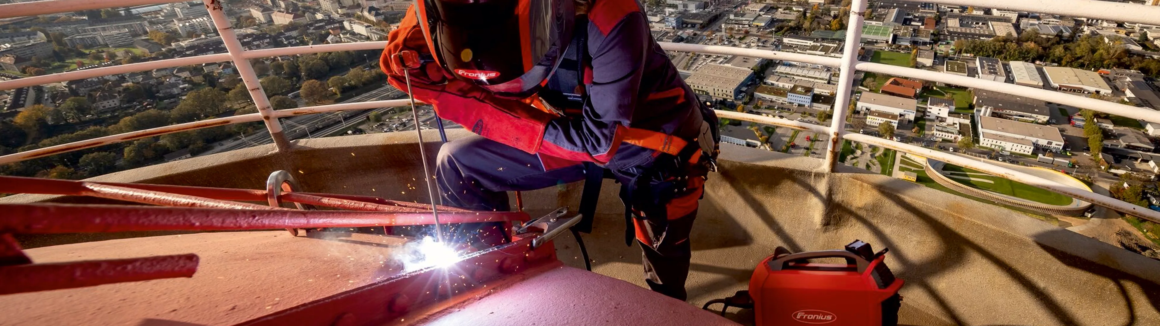 woman welding rooftop