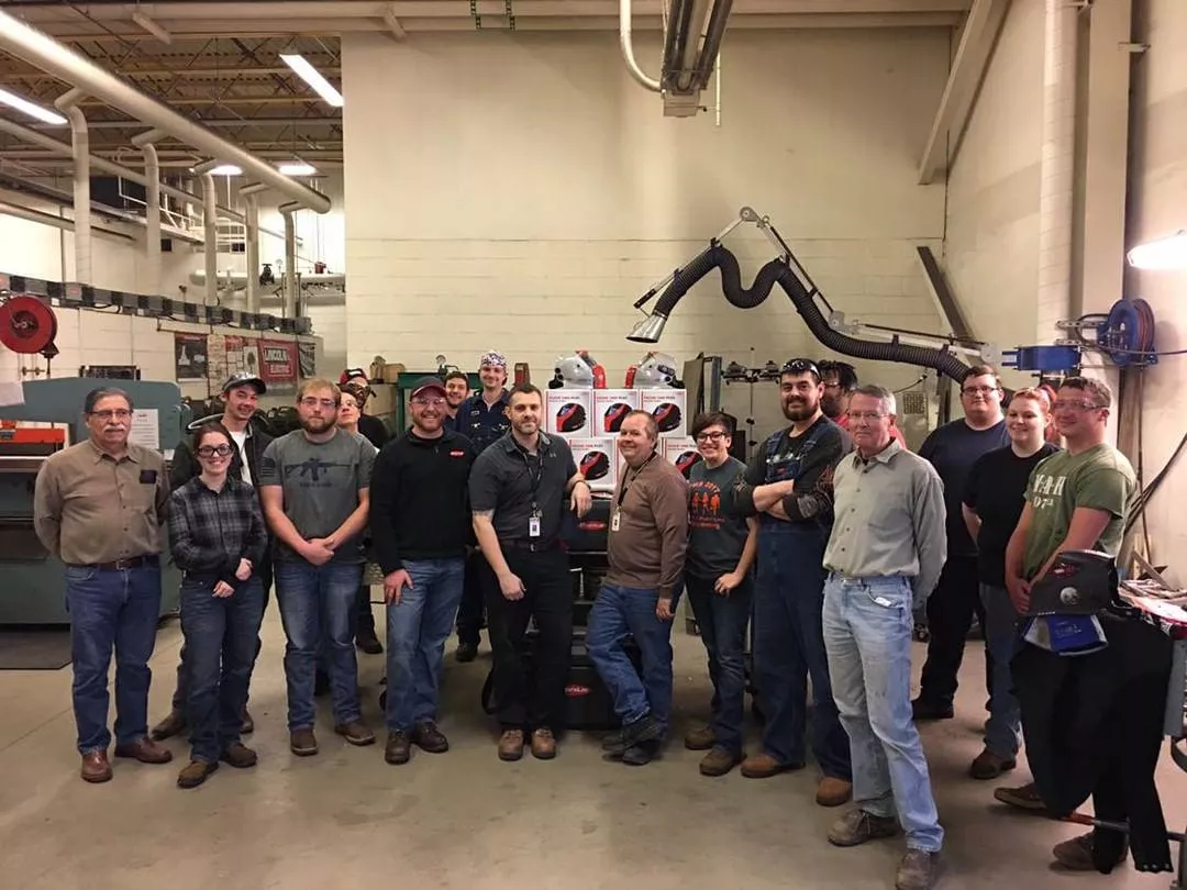 Ivy Tech Valpo students and teacher in front of donated gear
