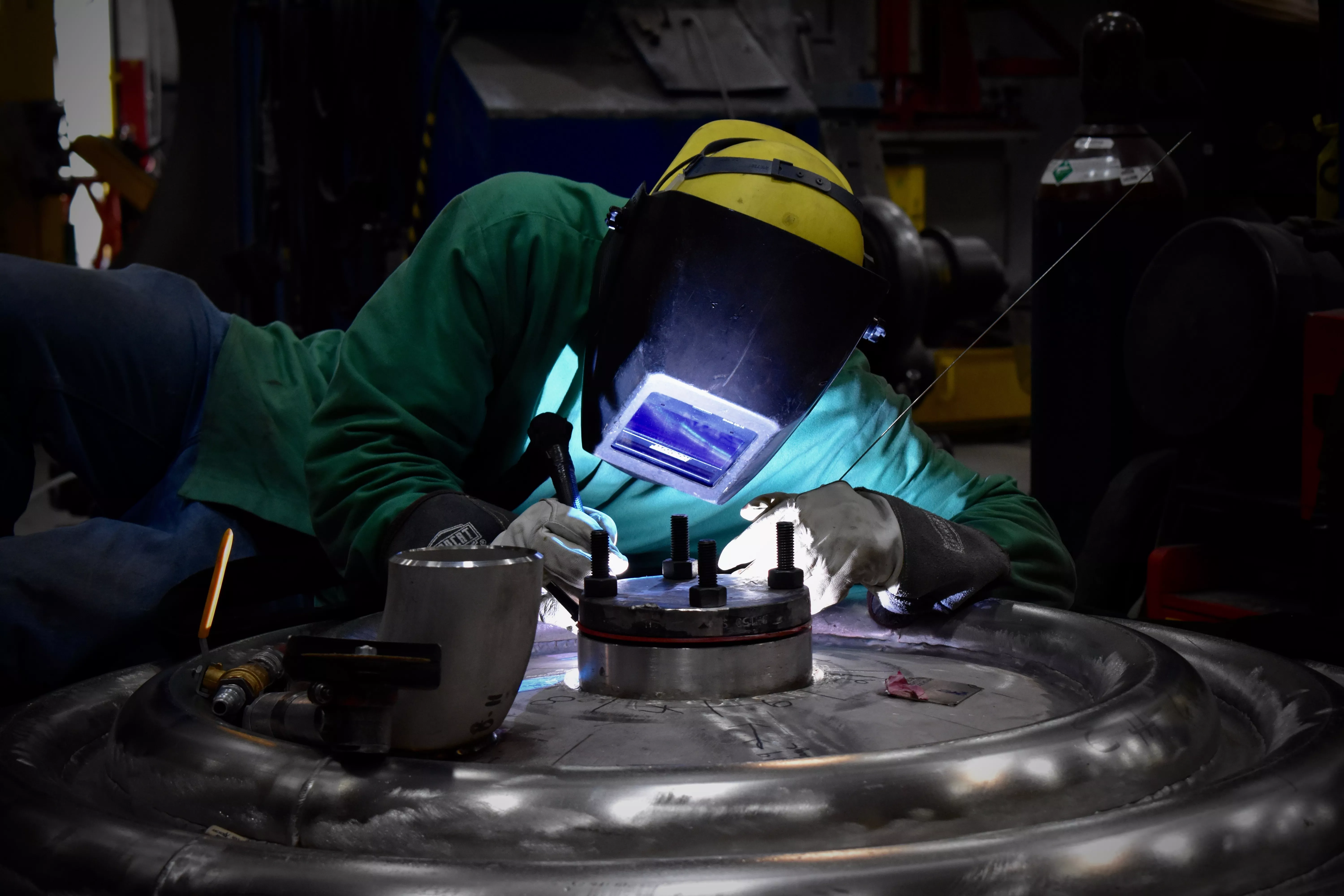 Stick welding a flange onto a tank head Stick welding a flange onto a tank head; Fronius USA