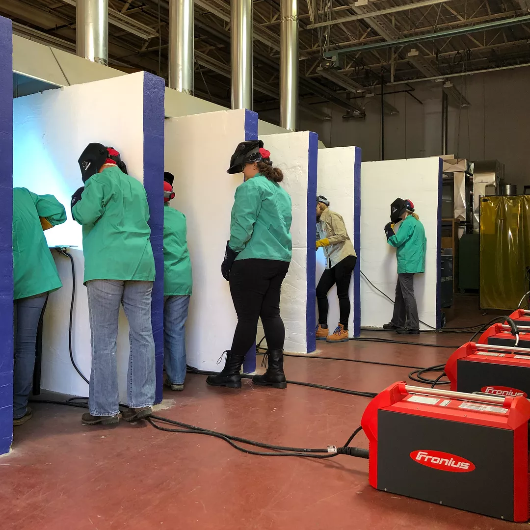 Participants practice in the Women Who Weld lab