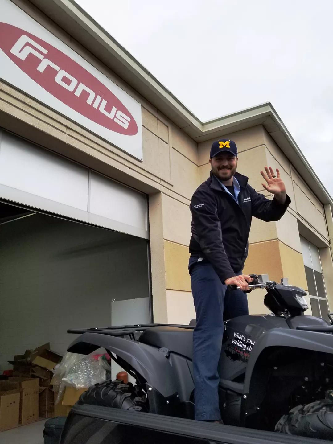 Kyle Briggs drives his ATV into his truck