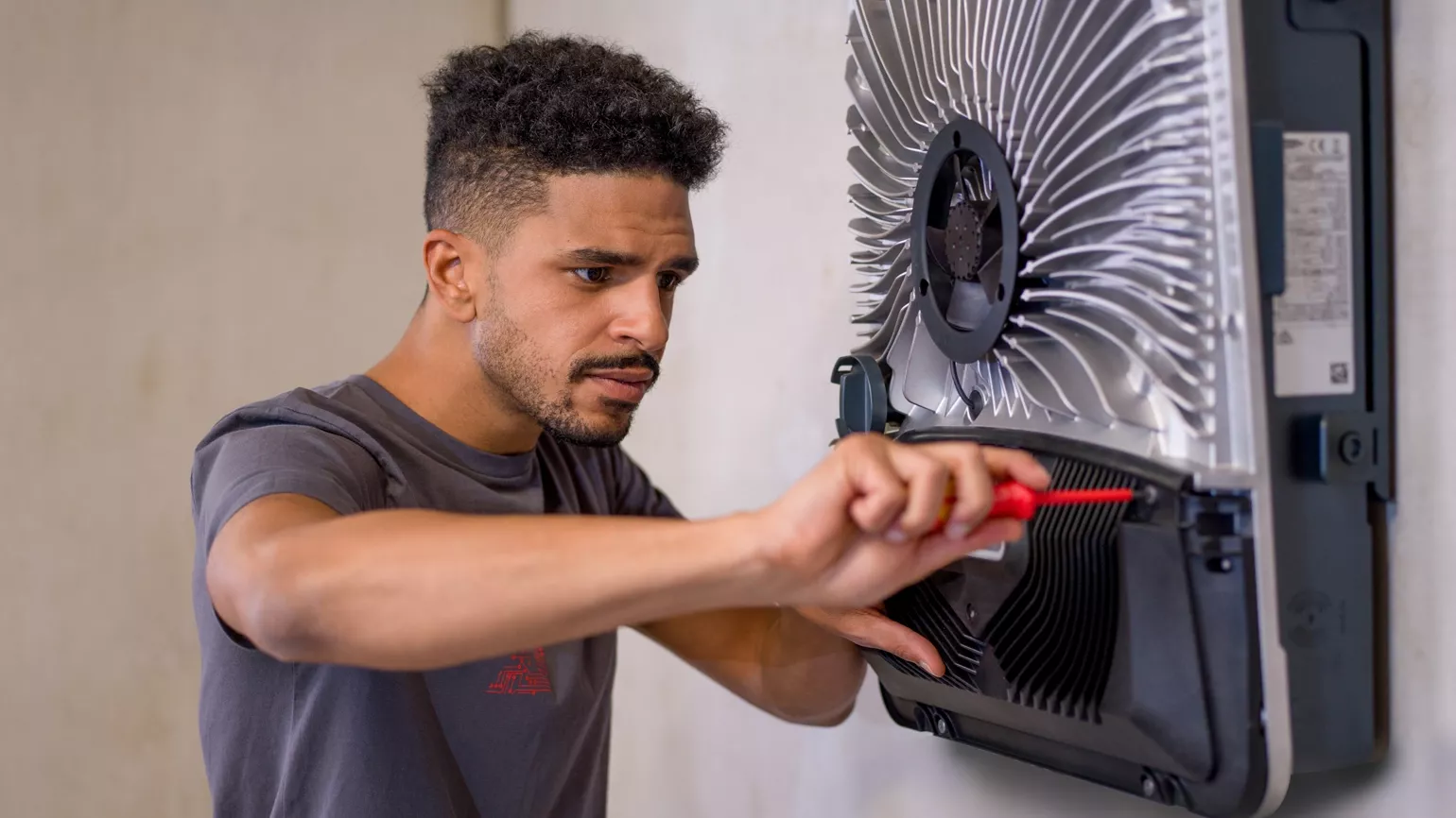 Installer tends to a Fronius inverter
